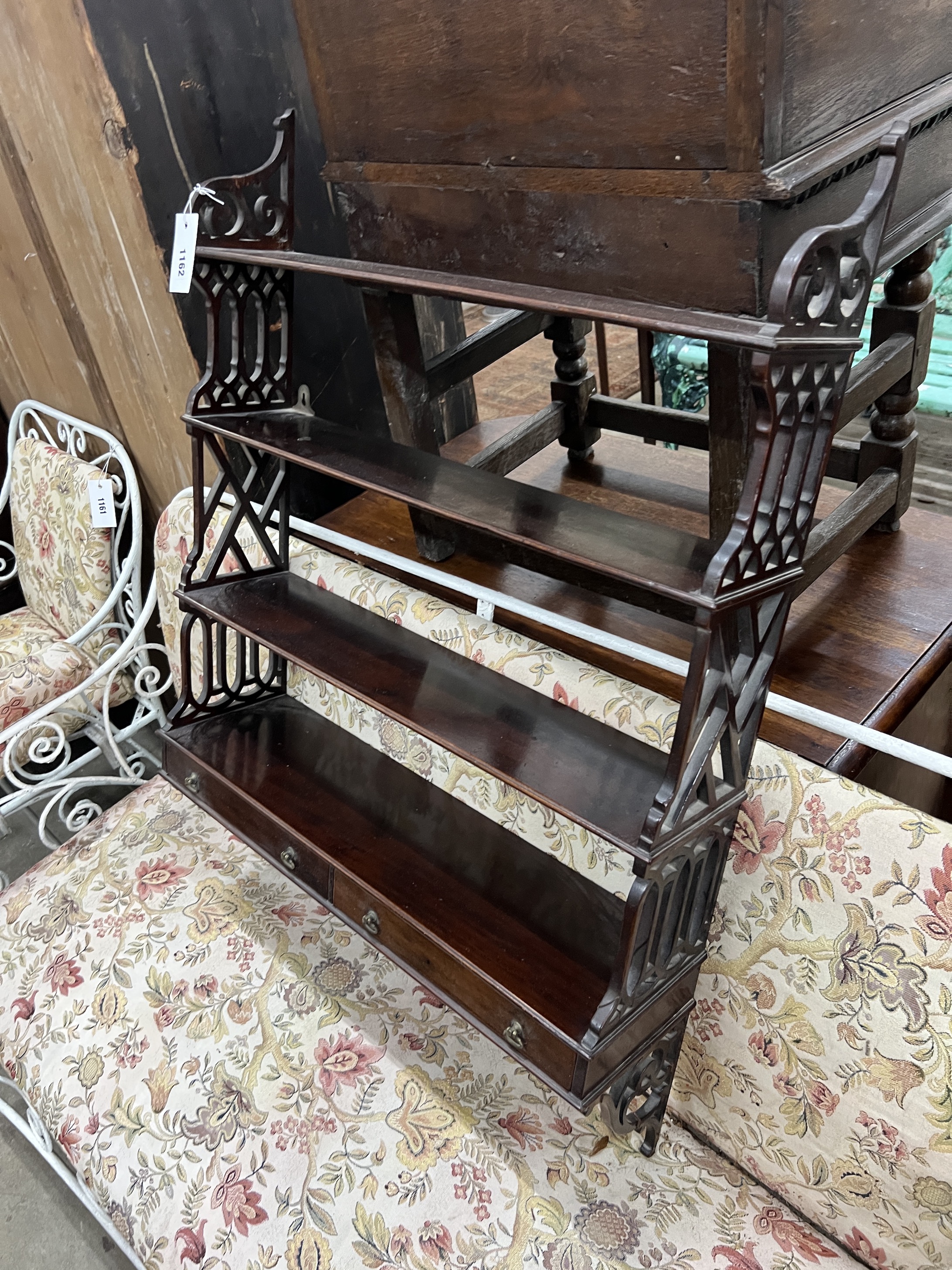 A reproduction George III style mahogany fretwork wall bracket, width 62cm, depth 17cm, height 88cm